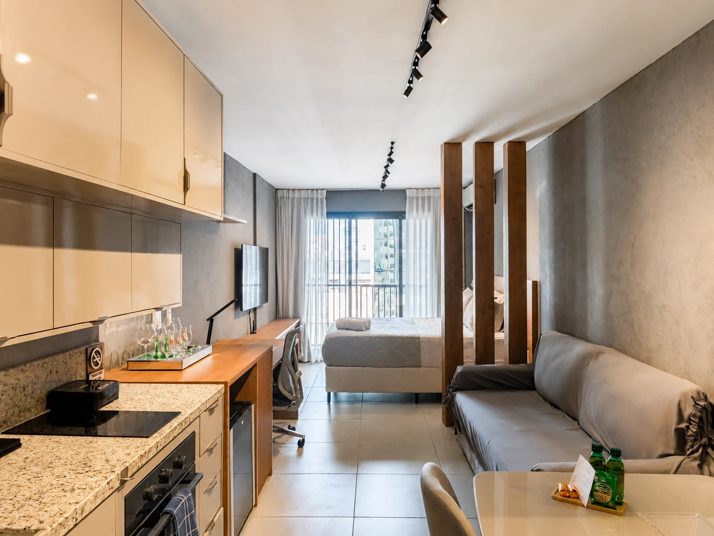 Open-plan view of the Skylux 1811 studio, showing the bedroom, living area and kitchen